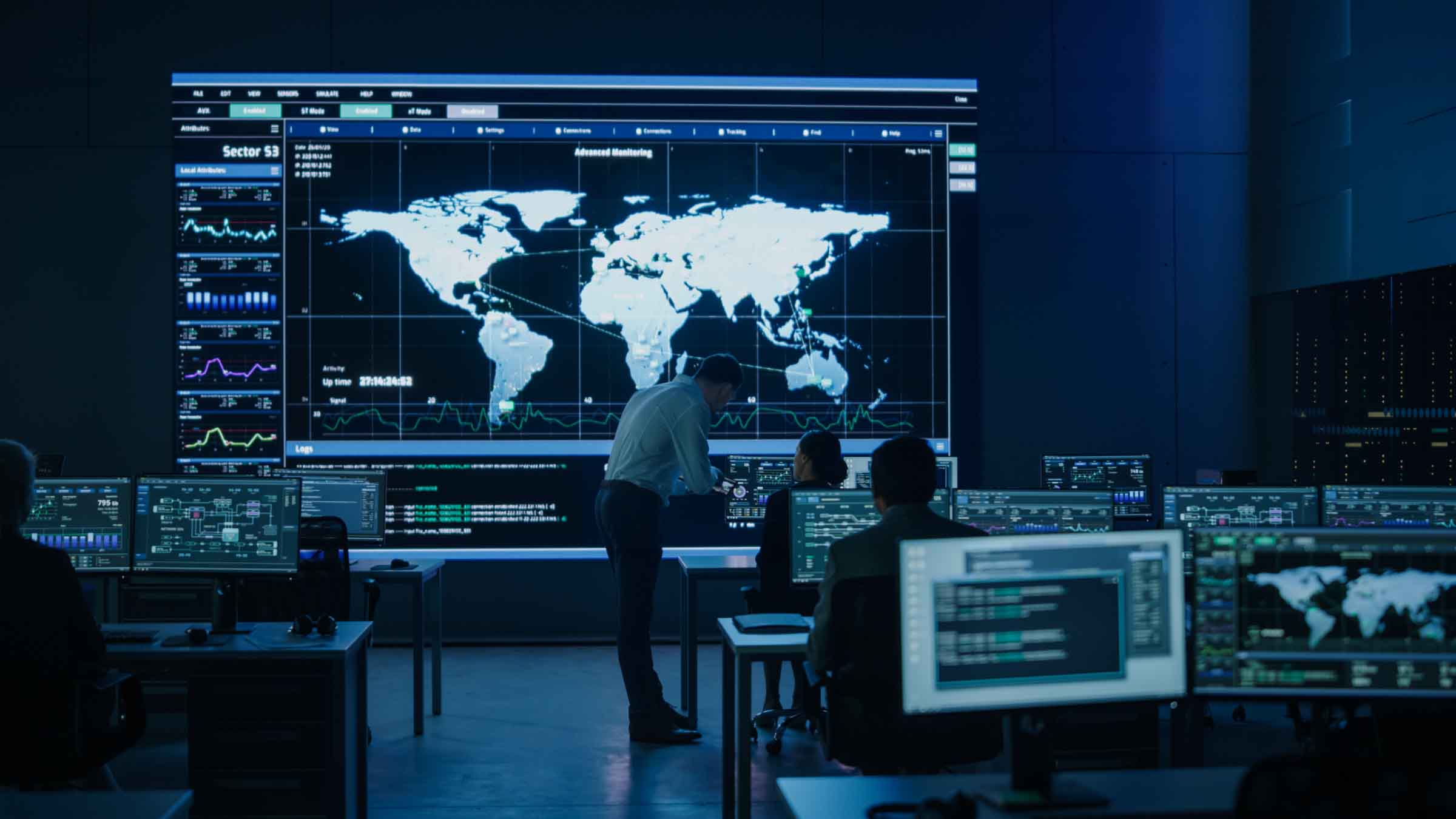 People around computers in control room, demonstrating By Light's cyber capabilities